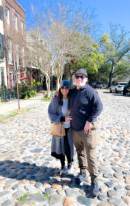 Standing on the charming cobblestone streets in Charleston